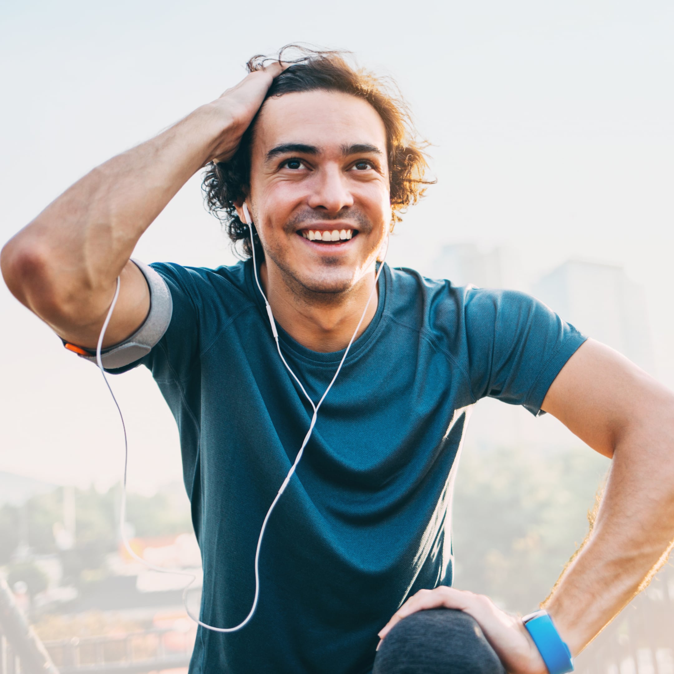Young man holding his hair feeling energy from NAD+